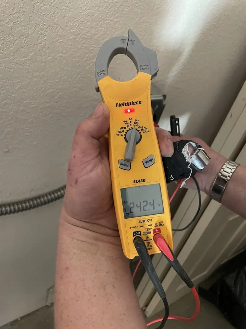 Voltage testing with clamp meter during Circuit Breaker Repair in Nixa